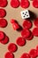 Playing board games detail, overhead flat lay shot of a die with a red pawn and pieces