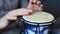 Playing Bongo drum close up HD stock footage. Hand tapping a Bongo drum in close up.