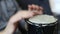 Playing Bongo drum close up HD stock footage. Hand tapping a Bongo drum in close up.