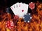 Playing cards and casino chips on fire. poker concept