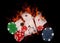 Playing cards and casino chips on fire. poker concept