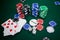 Playing cards, dices and casino chips on poker table