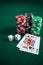 Playing cards, dices and casino chips on poker table