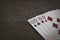 Playing cards. Four tens on a wooden table closeup. abstraction background and gambling.