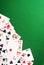 Playing cards on green casino background