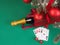 Playing cards and poker chips near a Christmas tree