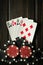 Playing cards with winning combination of four of a kind or quads on a black vintage table in a poker club. Winning in sports