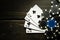 Playing cards with a winning combination two pairs on a antique black table in a poker club. Winning in sports depends on luck