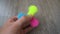 Playing with the colorful Fidget Spinner. Toy spinner in hand