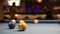 Playing Eight-ball pool billiards in a bar