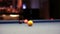 Playing Eight-ball pool billiards in a bar