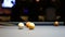 Playing Eight-ball pool billiards in a bar