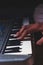 Playing the Electronic Keyboard in Music Recording studio close up on hands. Playing electronic Piano