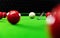 Playing snooker, piercing the red ball, black, aiming the ball and pocketing the hole to score points