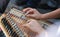 Playing Turkish Qanon Musical Instrument. Selective focus