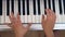 Playing white piano, Top view, Hand held shot