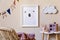 Playroom for kids with cute toys and mockup poster frame in Scandinavian style