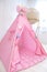 Playroom with Teepee. Modern room interior with play tent for child. pink wigwam