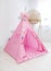 Playroom with Teepee. Modern room interior with play tent for child. pink wigwam