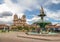 Plaza de Armas with Inca Fountain and Compania de Jesus Church - Cusco, Peru