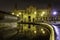 Plaza de EspaÃ±a in Seville, night scene after raining with long exposure photo and reflections of lights in water and cobbled