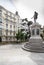 Plaza de las Cortes with statue of Miguel de Cervantes and to the building Plus Ultra Seguros, Madrid, Spain