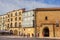 Plaza mayor with historic buildings and people in Soria