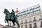 Plaza Mayor of Madrid with the King Phillip III statue on a horse and Tio Pepe Neon Sign in