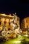 Plaza of various stone statues in fountain