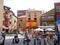 Plazuela Del Marques With A Large Flag Of Spain From Gijon On A Market Day. July 5, 2010. Asturias, Spain, Europe. Travel Tourism