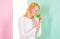 Pleasant aroma. Girl blonde holds shampoo bottle. Woman shows beauty product for hair. Hair treatment product. Girl