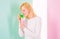 Pleasant aroma. Girl blonde holds shampoo bottle. Woman shows beauty product for hair. Hair treatment product. Girl