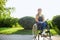 Pleasant brown-haired girl spending spare time outdoors