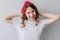 Pleasant caucasian girl in white t-shirt posing in studio. Indoor portrait of laughing gorgeous wom