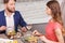 Pleasant couple during date in restaurant