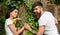 Pleasant date in nature environment. Man bearded hipster holds hand girlfriend. Couple in love romantic date walk nature