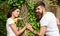 Pleasant date in nature environment. Man bearded hipster holds hand girlfriend. Couple in love romantic date walk nature