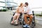 Pleasant disabled senior couple kissing outdoors