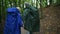 Pleasant elderly couple standing in the forest