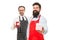 Pleasant gift sweetheart. Surprise her. Prepare surprise dinner. Household service. Men bearded hipster apron hold gift