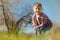 Pleasant little boy digging in the garden