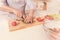 Pleasant man cooking salad in the kitchen