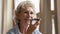 Pleasant mature female calling grandchild using voice dialing