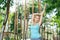 Pleasant nice young woman practicing yoga outdoors