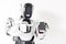 Pleasant robot is standing with smartphone