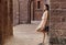 Pleasant Teenage Girl in Brick Courtyard