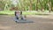 Pleasant woman in hijab and sport clothes sitting on yoga mat and stretching body. Young muslim female training during