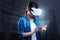 Pleasant woman in VR headset using tablet