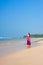 Pleasant woman walking at the beach