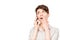 Pleasantly shocked woman with mobile phone on a white